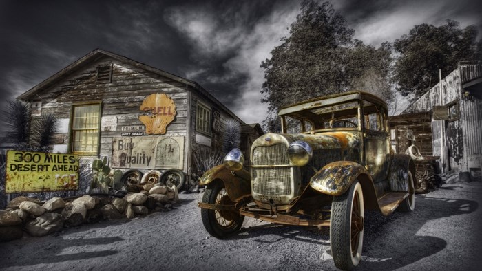 Rusty Ford Model A truck at old Shell station