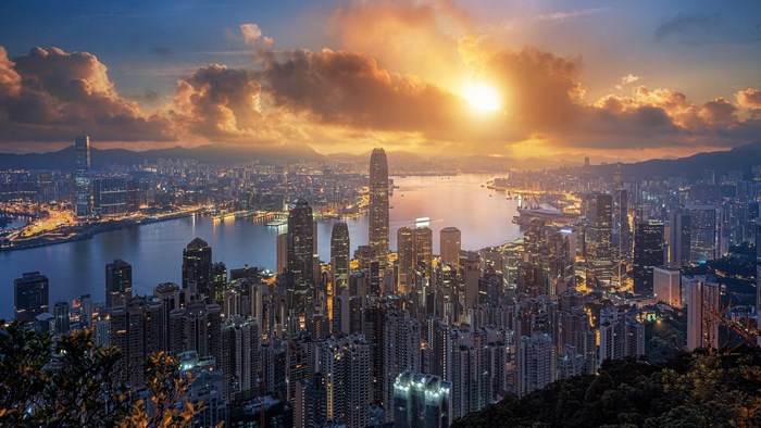 Hong Kong skyline at sunset with Victoria Harbour