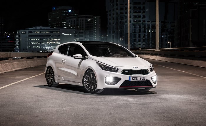 White Kia Ceed GT parked at night