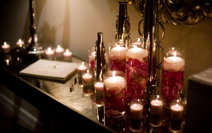 Candles on a reflective surface