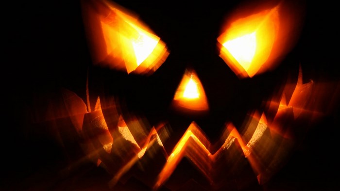Scary Jack-o'-lantern with glowing eyes and mouth