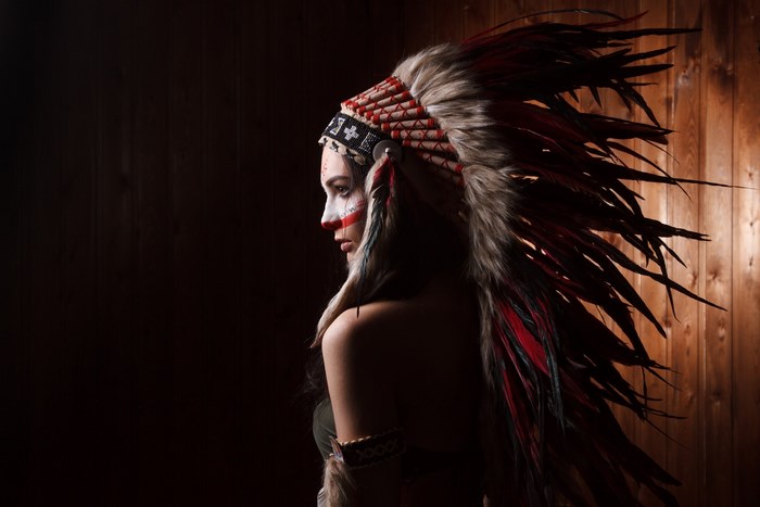 Profile of Woman Wearing Native American Headdress