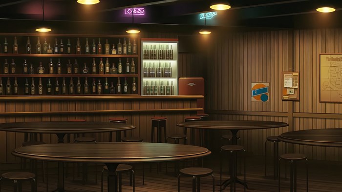 Bar interior with shelves of bottles and tables