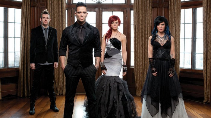 Skillet band members posing in formal attire