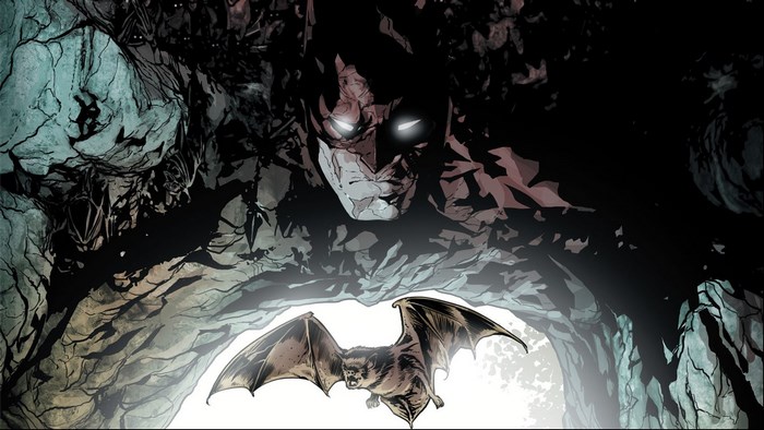 Batman in a cave with a bat