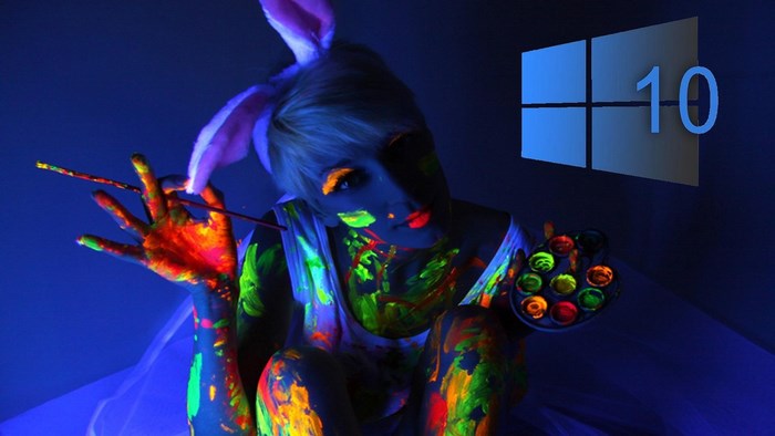 Woman painted with neon colors and Windows 10 logo