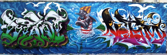Graffiti mural with dolphin and seagulls
