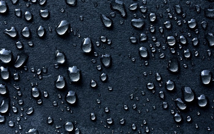 Water drops on a dark surface