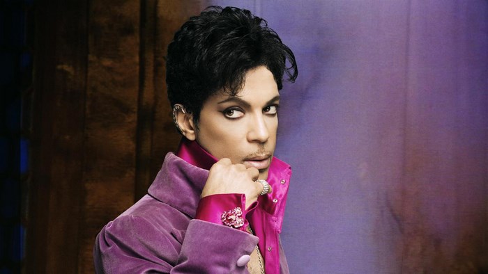 Prince in a purple velvet jacket