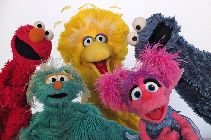 Sesame Street characters Elmo, Big Bird, Abby Cadabby, Cookie Monster, and Rosita