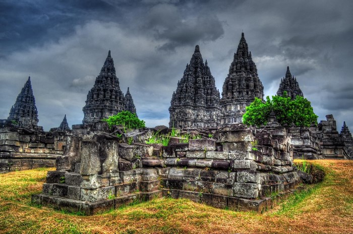 Prambanan Temple ruins under a cloudy sky
