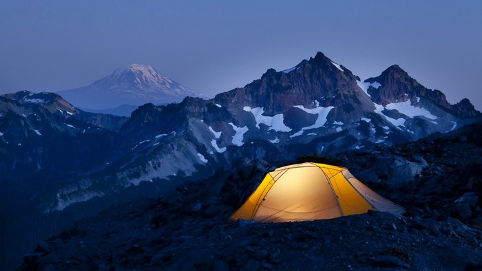 Tent in mountains at dusk