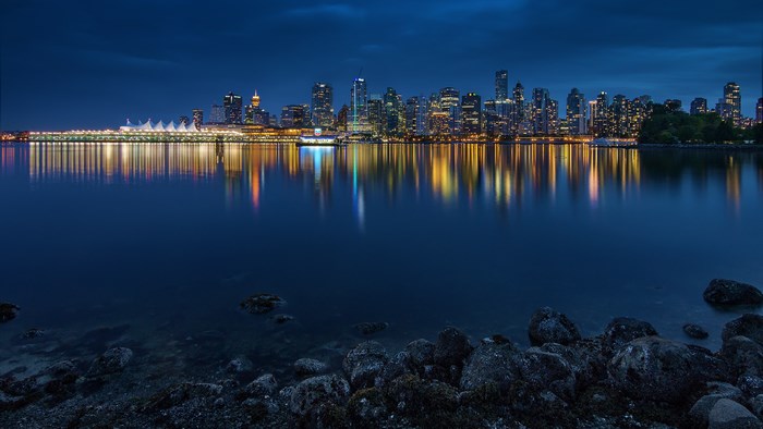 Vancouver skyline at night with reflections