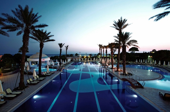 Limak Atlantis De Luxe Hotel swimming pool at dusk