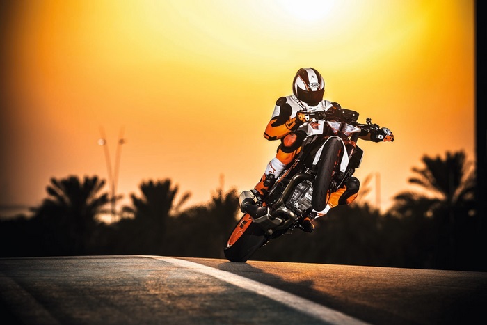 KTM 1290 Super Duke R motorcycle stunt at sunset