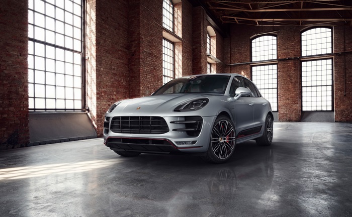 Silver Porsche Macan Turbo in industrial loft