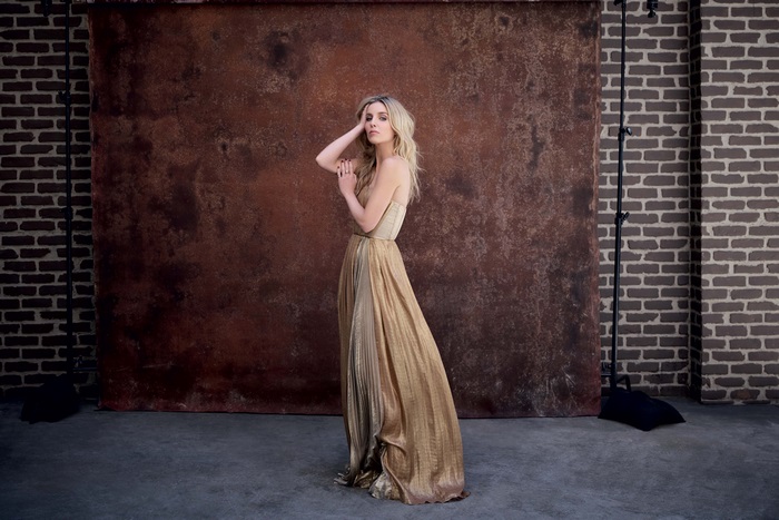 Annabelle Wallis in a golden dress