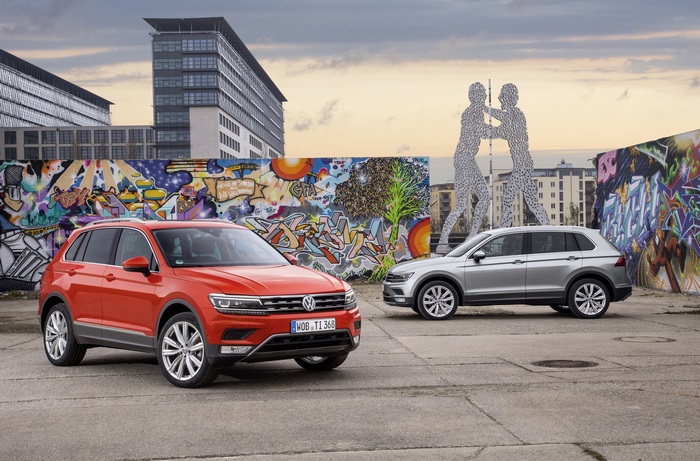 Volkswagen Tiguan cars in front of graffiti wall