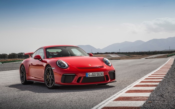 Red Porsche 911 GT3 on a Racetrack