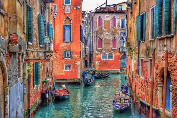 Venice canal with gondolas and historic buildings