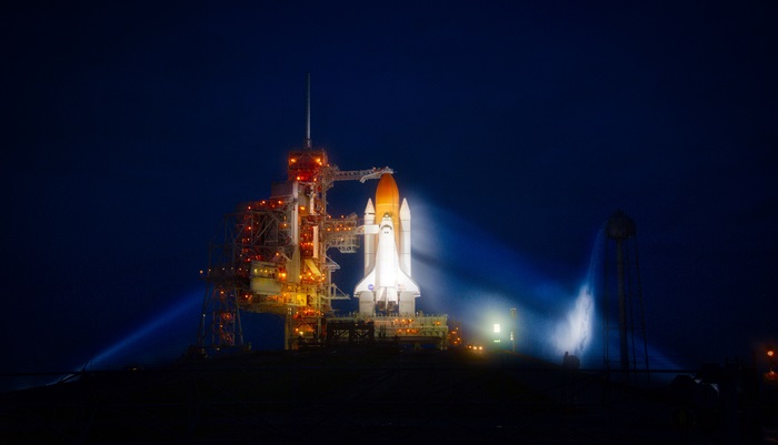Space Shuttle Atlantis on Launch Pad at Night