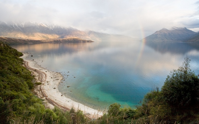 Lake with Mountains and Rainbow