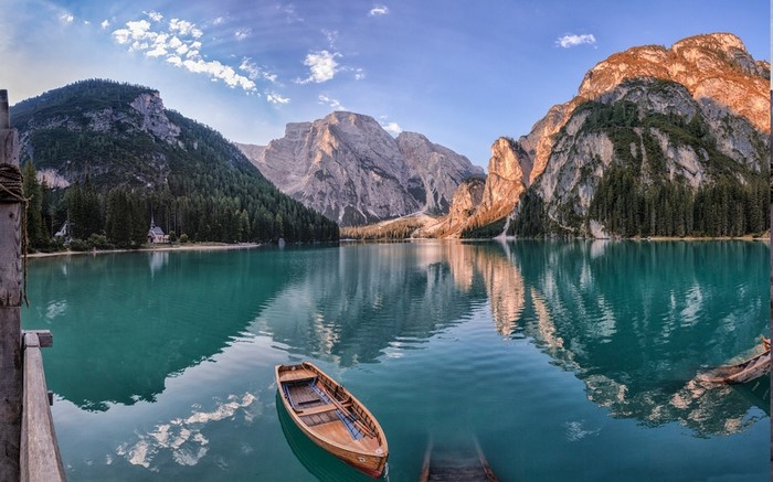 Lake with Mountains and Boat in Italy