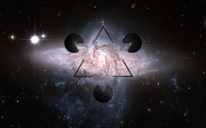 Triangle with Pac-Man shapes over a spiral galaxy