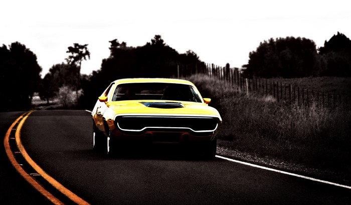 Yellow muscle car on a road
