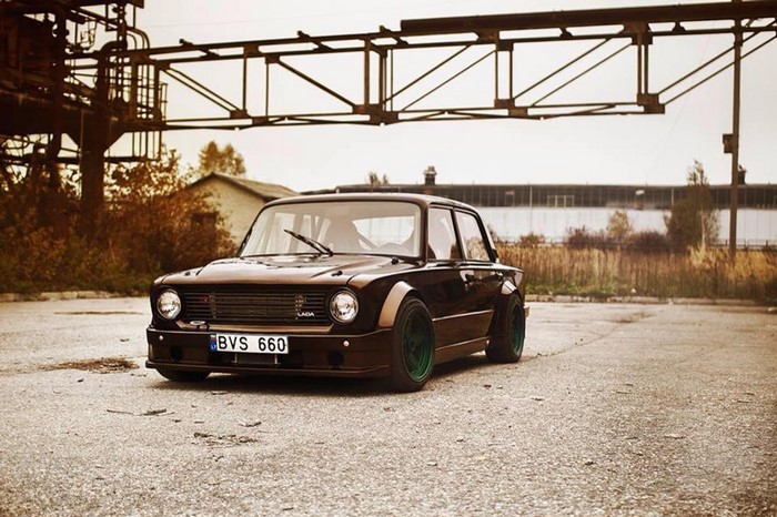 Modified Lada car with green wheels