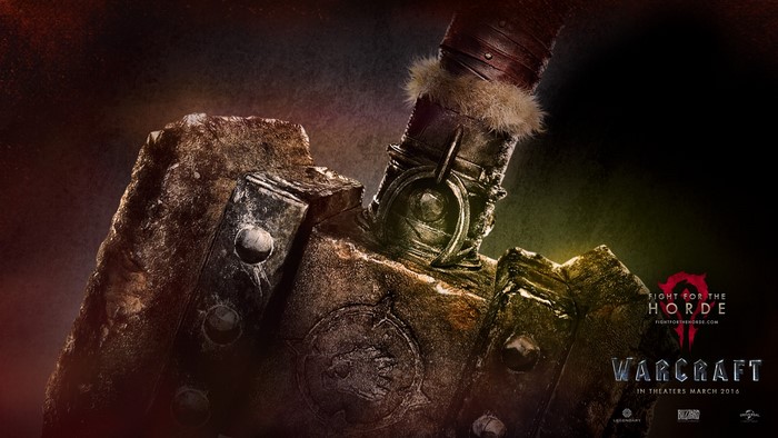 Warcraft movie poster with Orc weapon