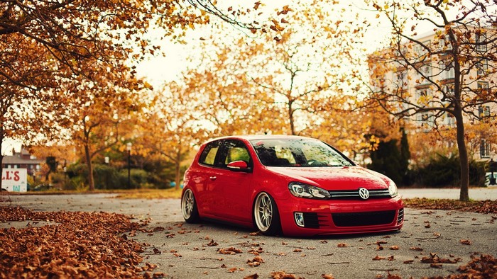 Red Volkswagen Golf GTI in Fall