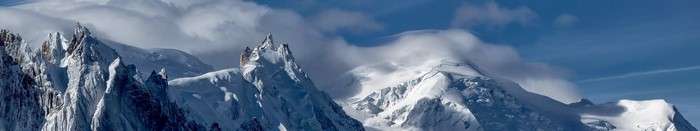 Snowy mountain landscape with clouds