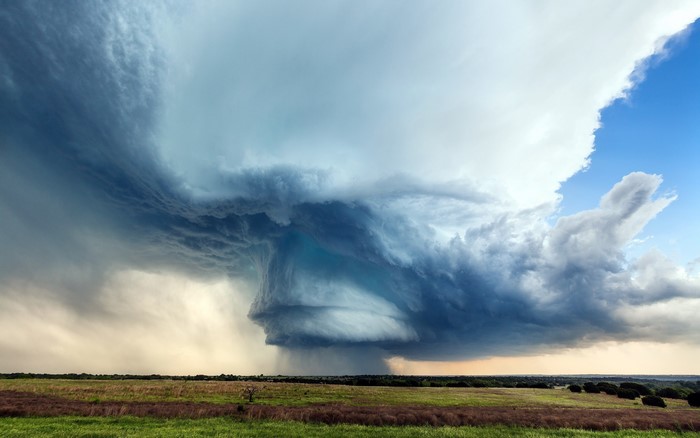 Storm clouds over a grassy field