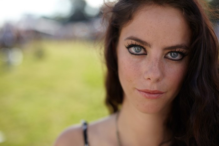 Kaya Scodelario with blue eyes and freckles outdoors