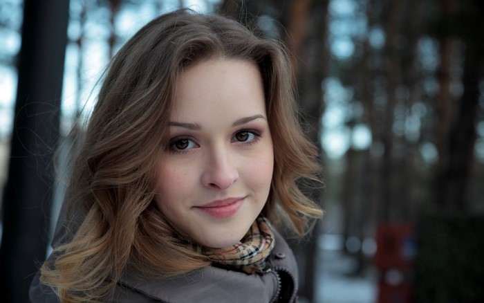 Blonde Woman Looking at Viewer with Soft Smile