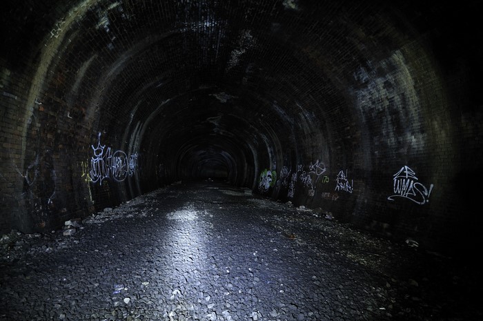 Dark tunnel with graffiti