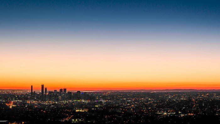 Cityscape at sunset with gradient sky