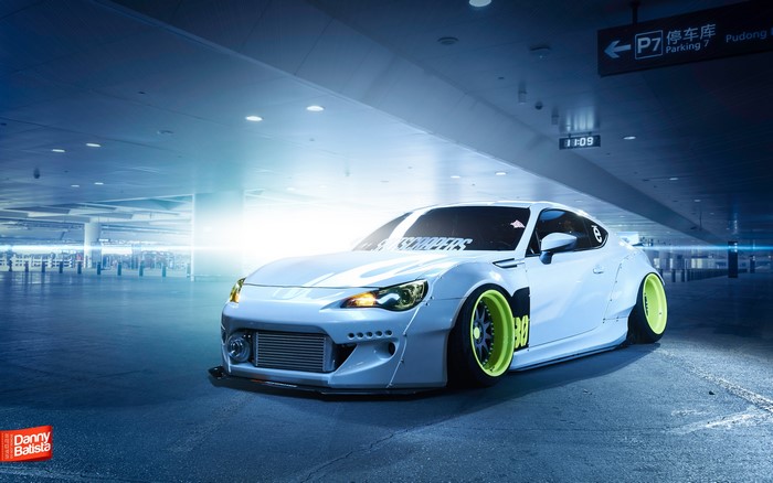 Modified White Subaru BRZ in Urban Parking Lot