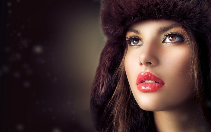 Woman wearing a fur hat with red lipstick