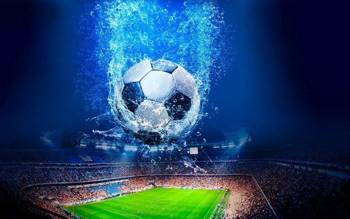 Soccer ball splashing in water over stadium