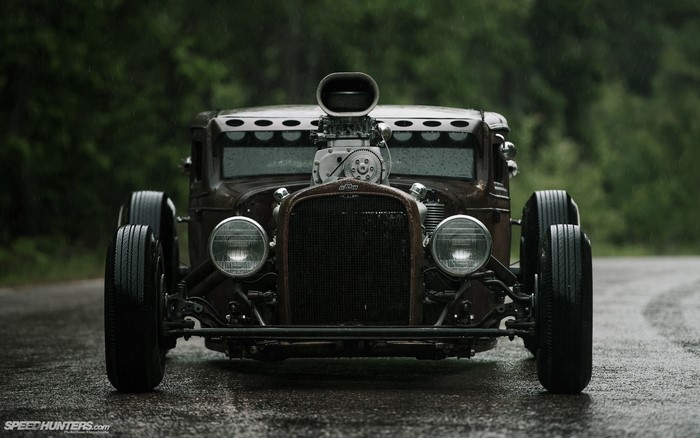 Front view of a vintage Chevrolet hot rod with a supercharger