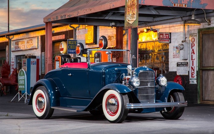 1929 Ford Model A Roadster at a vintage gas station