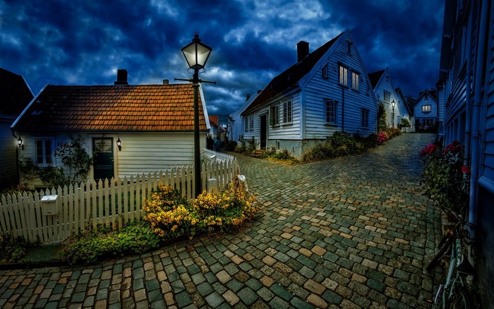 Cozy Norwegian Village Street at Night with Lamplight