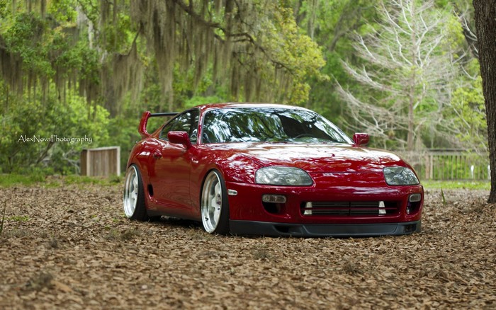 Red Toyota Supra MK4 Sports Car in Forest
