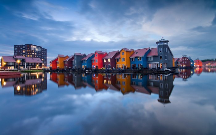 Colorful houses reflected in water in the Netherlands