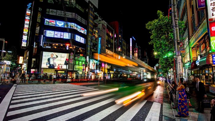 Night street in Japan with a busy crosswalk