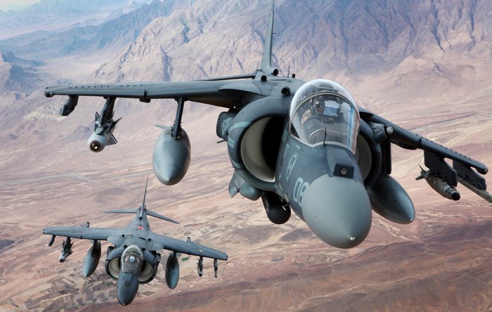 Two AV-8B Harrier II attack aircraft in flight