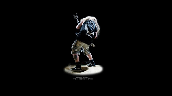 Dimebag Darrell playing guitar on stage