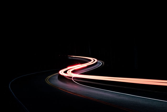 Road light trails at night